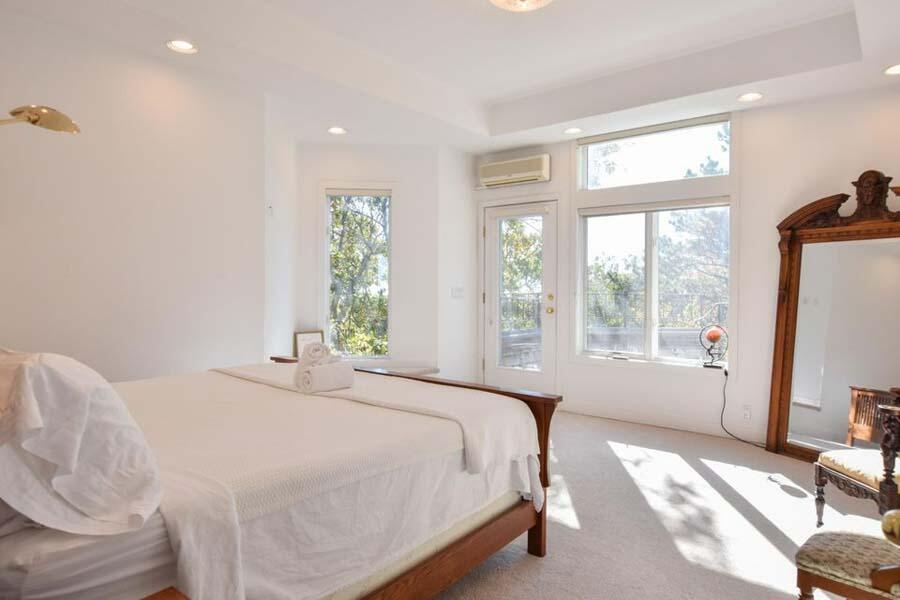16 Thistlemore Road Provincetown, MA 02657 - Photo 23 of 27 a bedroom with a bed and a large window
