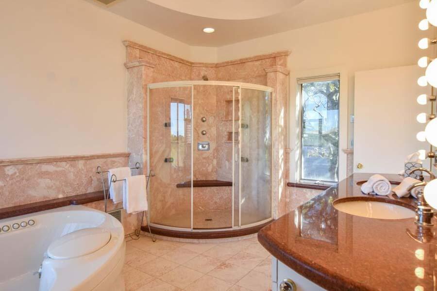 16 Thistlemore Road Provincetown, MA 02657 - Photo 25 of 27 a bathroom with a granite countertop sink a toilet and shower