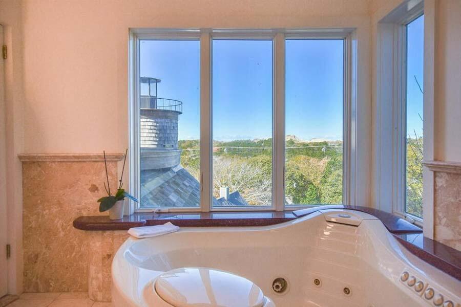16 Thistlemore Road Provincetown, MA 02657 - Photo 26 of 27 a bathroom with a tub and a large window