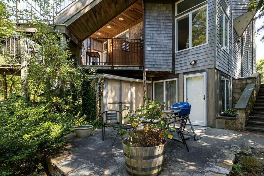16 Thistlemore Road Provincetown, MA 02657 - Photo 6 of 27 a front view of a house with outdoor seating