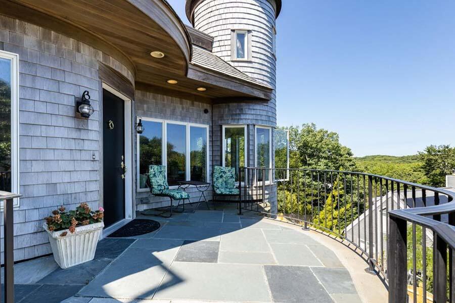 16 Thistlemore Road Provincetown, MA 02657 - Photo 7 of 27 a view of a patio with couches table and chairs and potted plants
