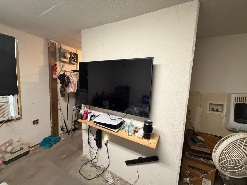 9300 Johns Road Alvarado, TX 76009 - Photo 27 of 40 a room with furniture and flat screen tv