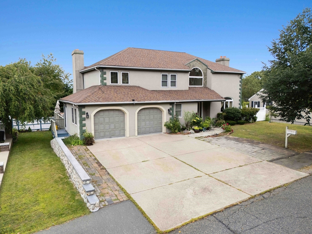 141 Gardiner Road Quincy, MA 02169 - Photo 2 of 35 a front view of a house with a yard
