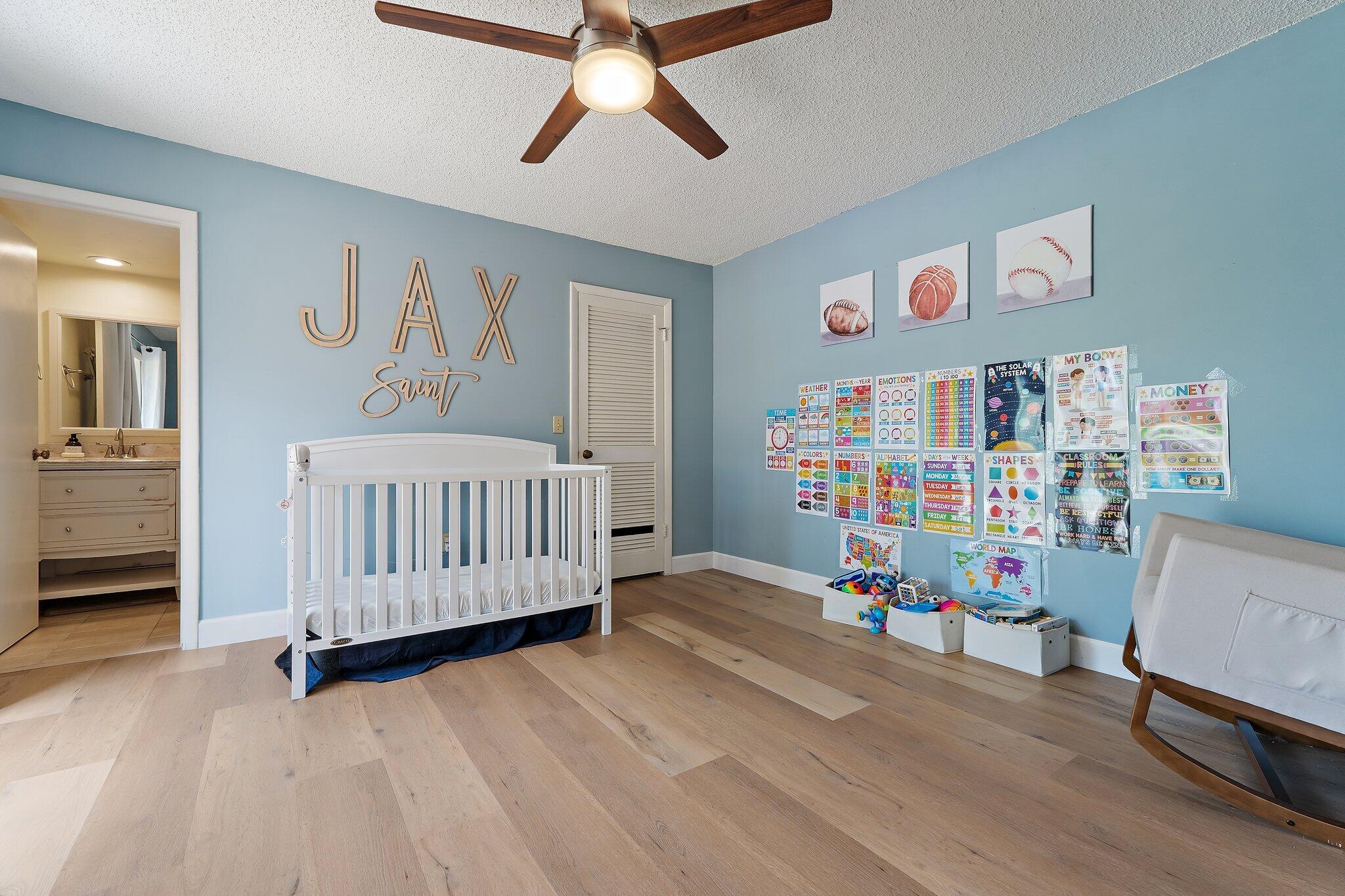 825 Center Street, Unit 30A Jupiter, FL 33458 - Photo 24 of 33 a bedroom with furniture and a book shelf