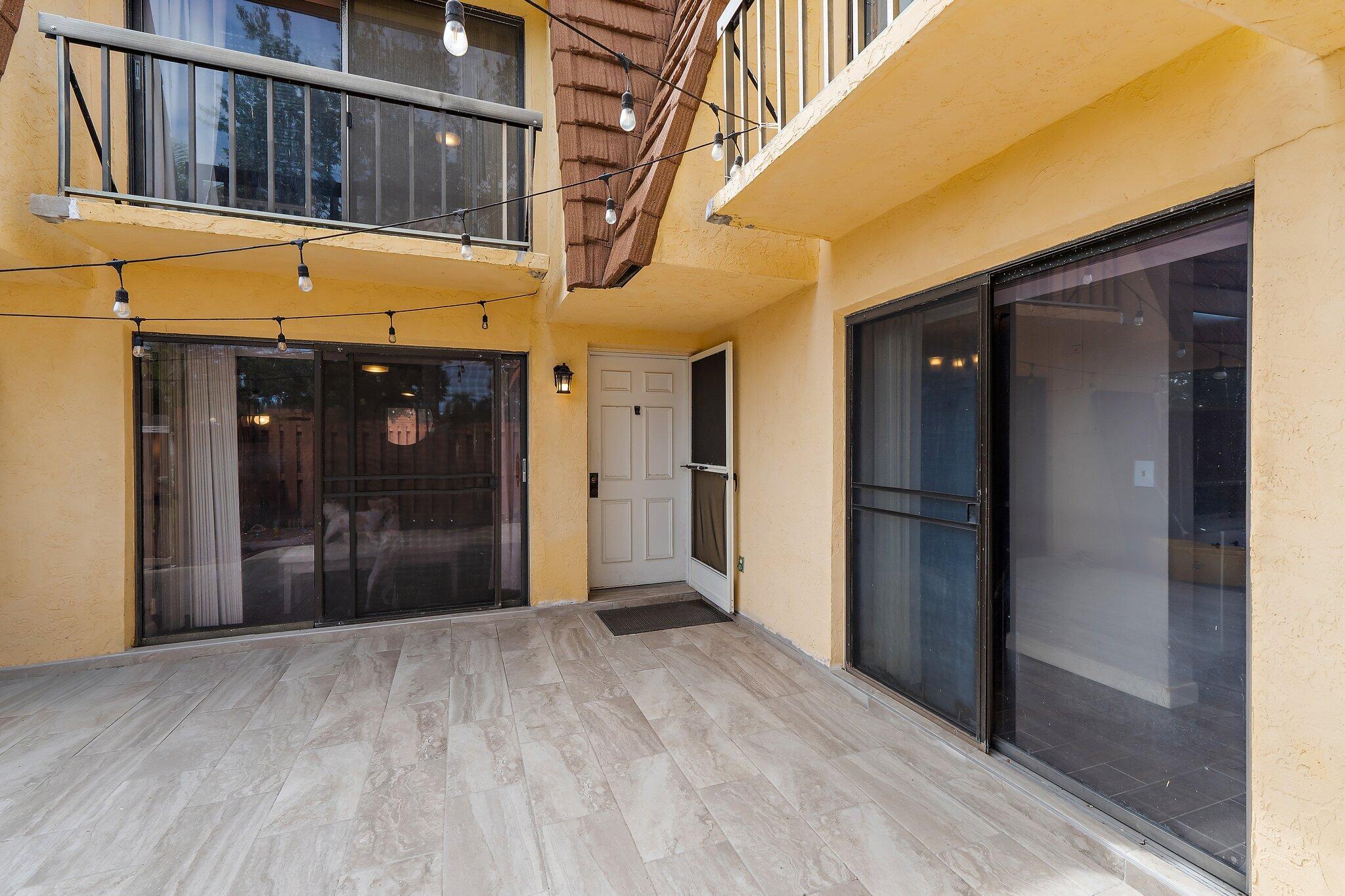 825 Center Street, Unit 30A Jupiter, FL 33458 - Photo 7 of 33 a view of a hallway with wooden floor