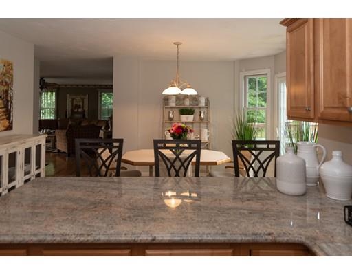 5 Luce Circle Canton, MA 02021 - Photo 7 of 24 a view of a dining room with furniture and chandelier