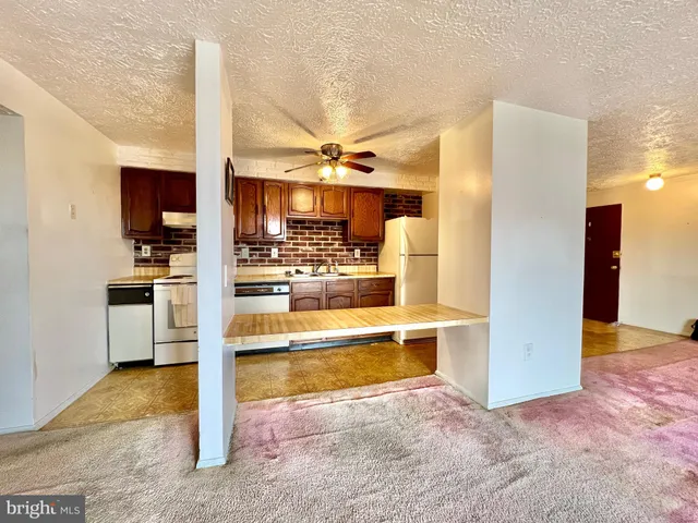 a view of kitchen and kitchen with sink