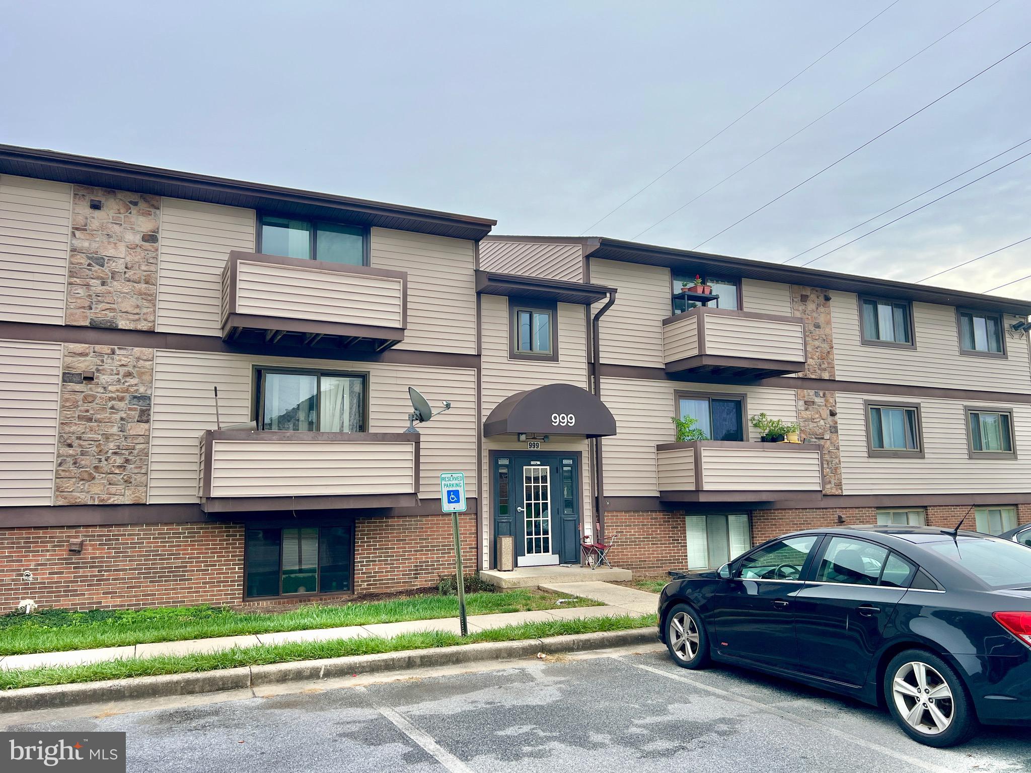 999 Heather Ridge Drive, Unit 2L Frederick, MD 21702 - Photo 18 of 19 a car parked in front of a house