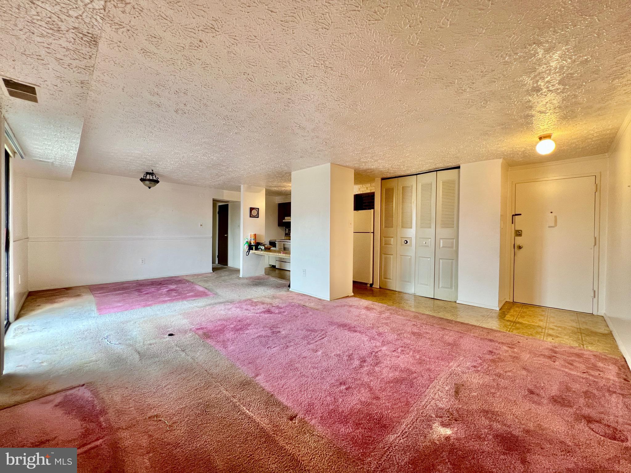 999 Heather Ridge Drive, Unit 2L Frederick, MD 21702 - Photo 6 of 19 a view of empty room with a yard