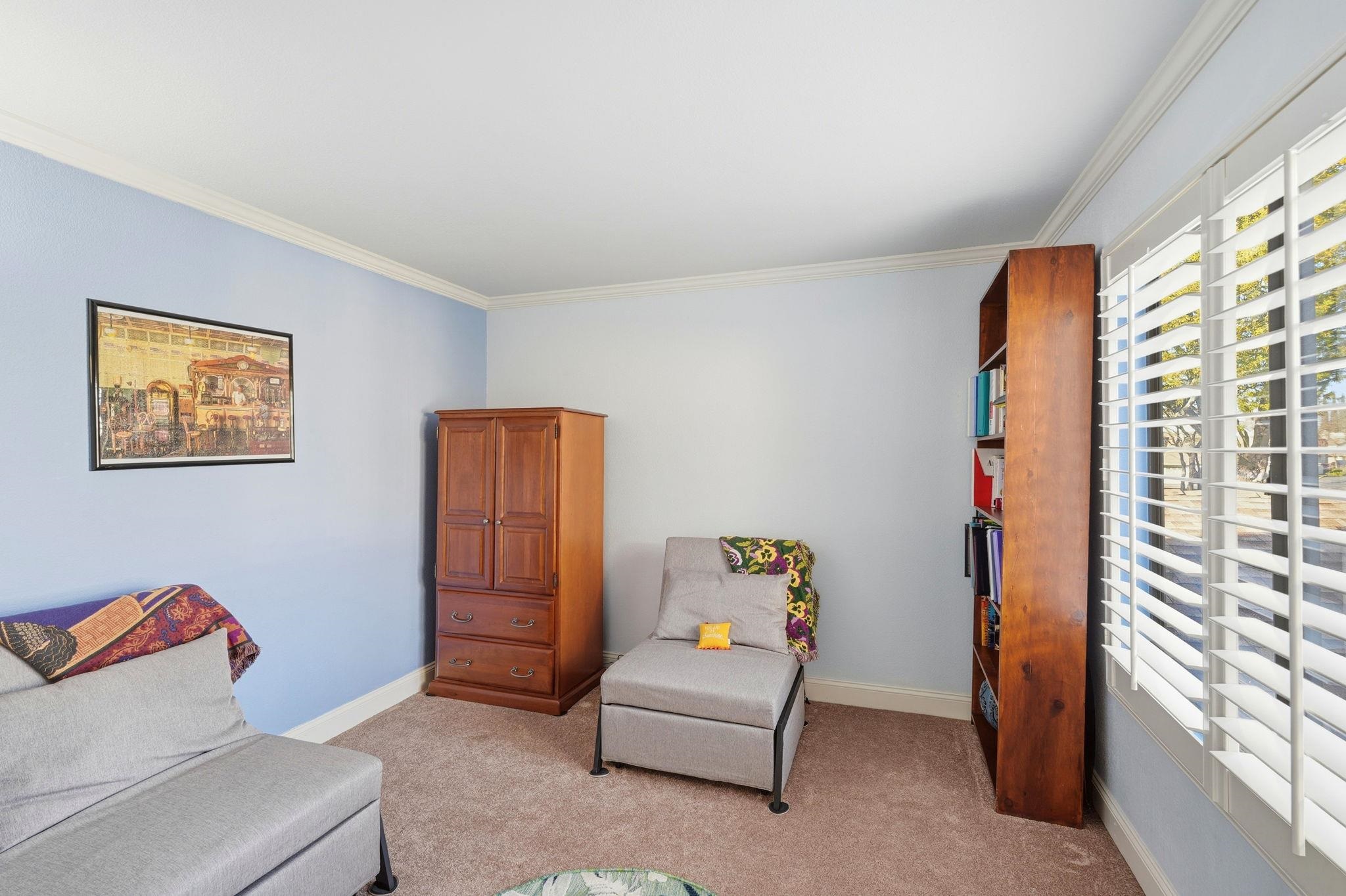 1643 West Swain Road Stockton, CA 95207 - Photo 16 of 27 a living room with furniture and a window