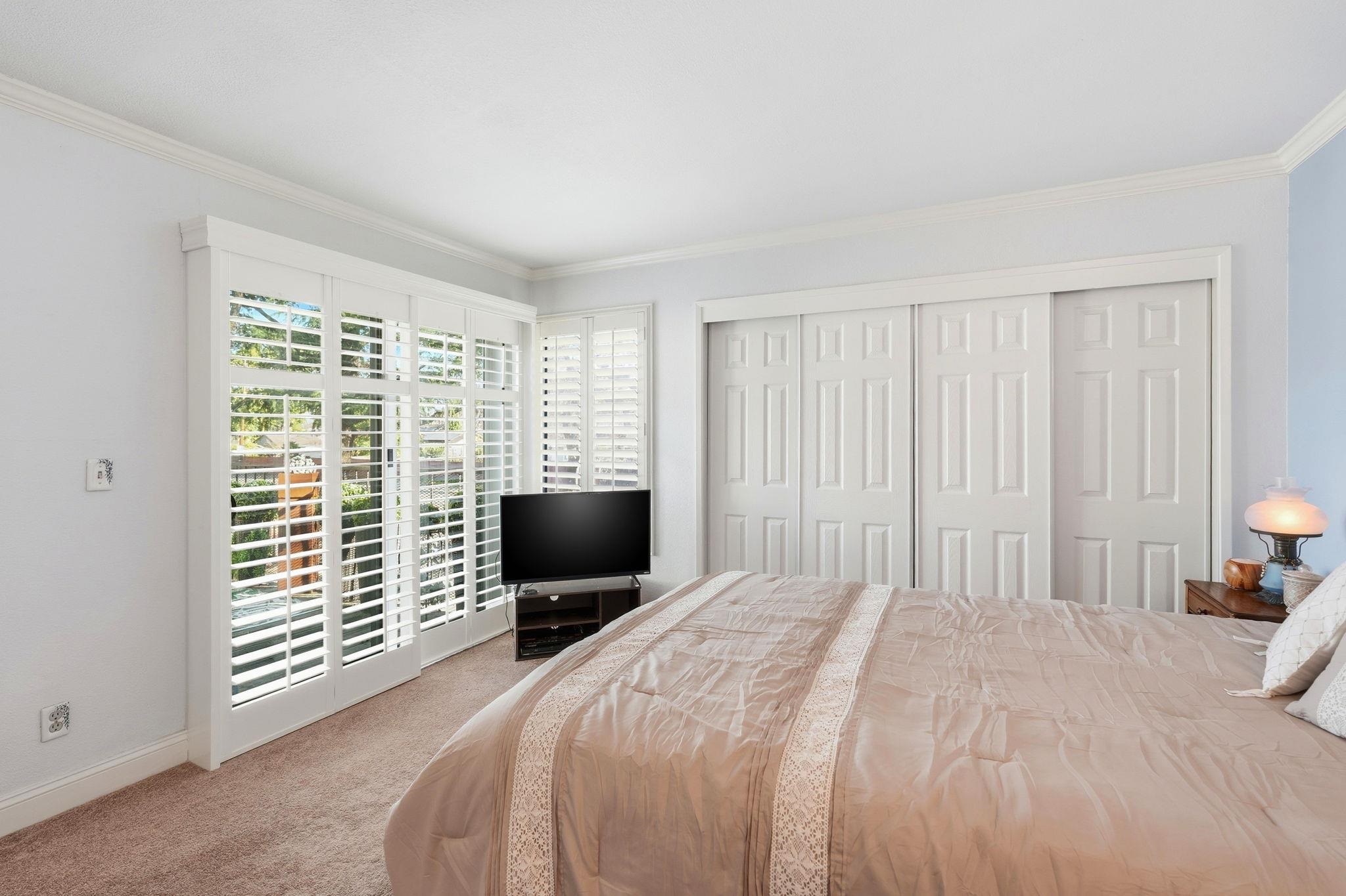 1643 West Swain Road Stockton, CA 95207 - Photo 19 of 27 a bedroom with a bed and a flat screen tv