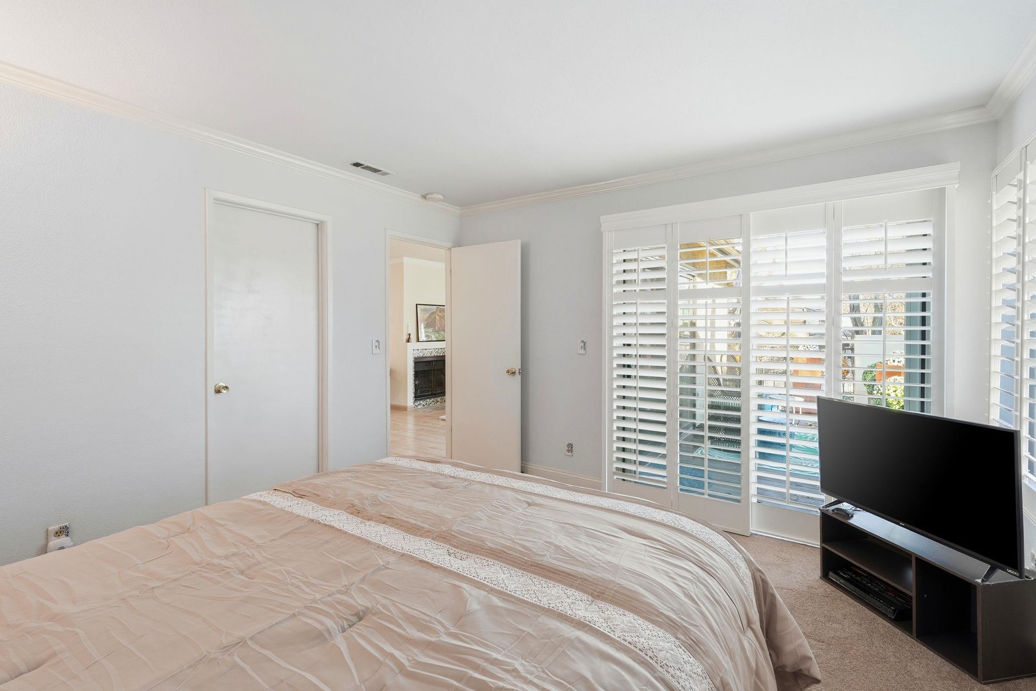 1643 West Swain Road Stockton, CA 95207 - Photo 20 of 27 a bedroom with a bed and a television