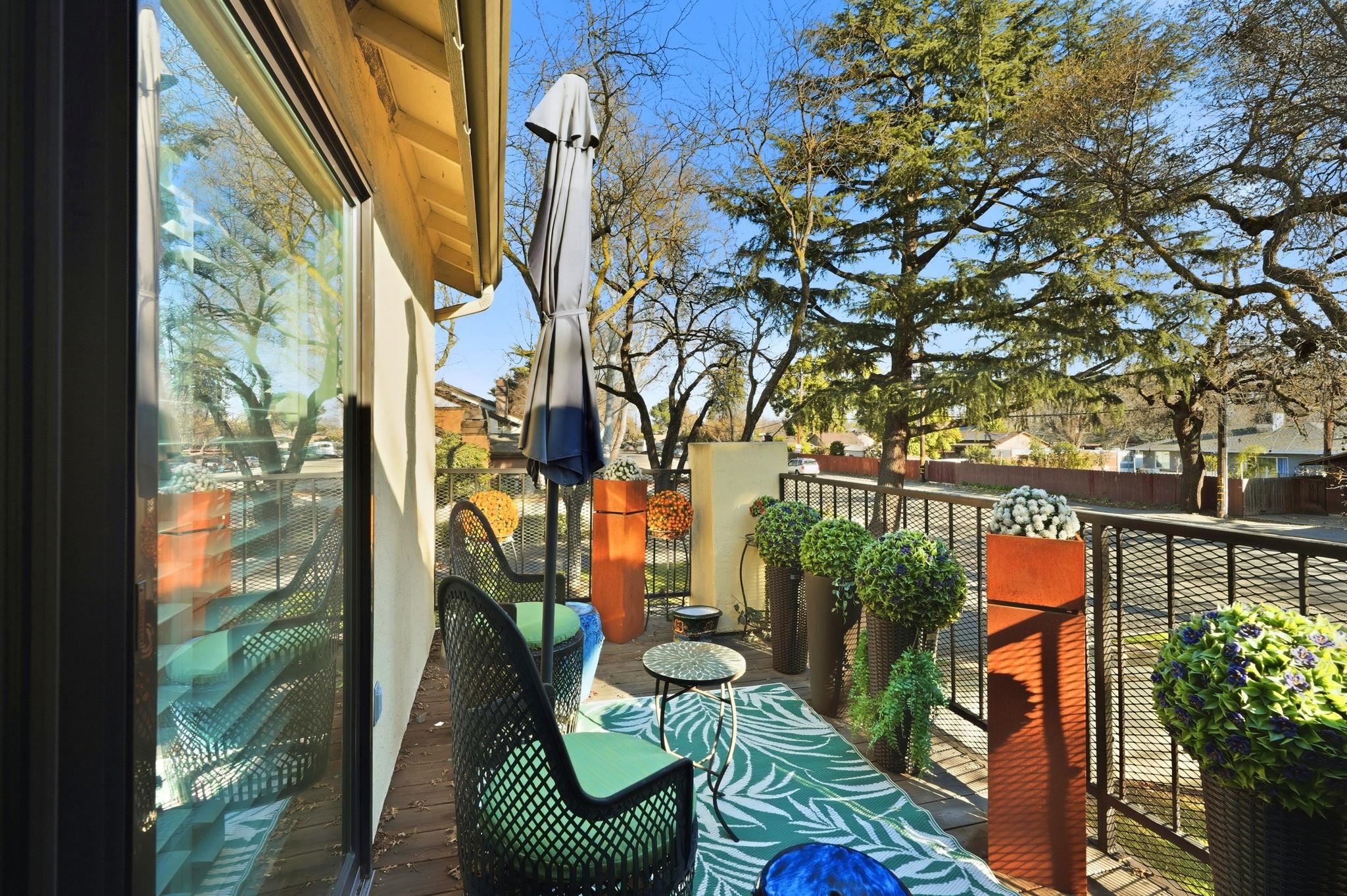 1643 West Swain Road Stockton, CA 95207 - Photo 23 of 27 a balcony with couple of chairs and a couch