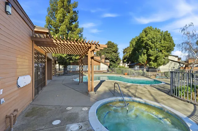 swimming pool view with a backyard space