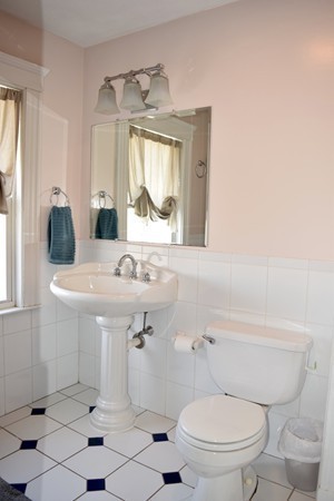 24 Norwell Road Dedham, MA 02026 - Photo 13 of 21 a bathroom with a sink toilet and mirror