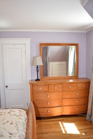 24 Norwell Road Dedham, MA 02026 - Photo 18 of 21 a bedroom with a bed and a dresser
