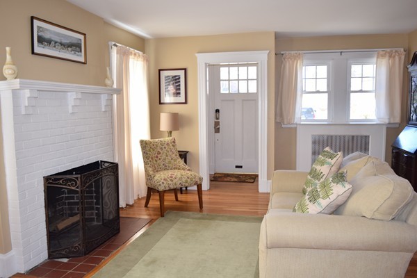 24 Norwell Road Dedham, MA 02026 - Photo 2 of 21 a living room with furniture and a fireplace