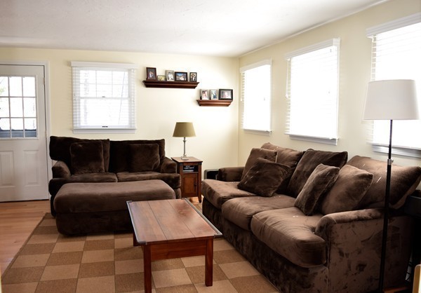 24 Norwell Road Dedham, MA 02026 - Photo 9 of 21 a living room with furniture a window and a lamp