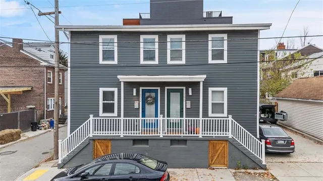 a view of a brick house with a large window