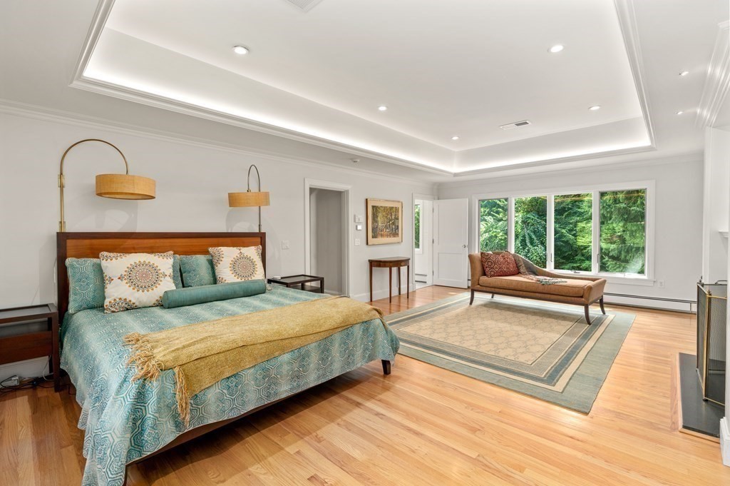 108 Nehoiden Road Newton, MA 02468 - Photo 22 of 42 a bedroom with a large bed and a large window