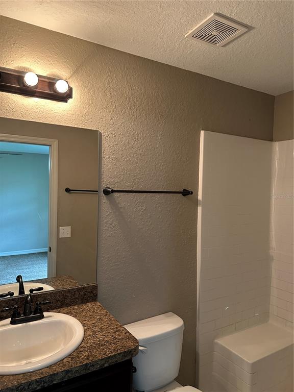 5663 Northwest 57th Street Ocala, FL 34482 - Photo 15 of 19 a bathroom with a granite countertop sink and a mirror