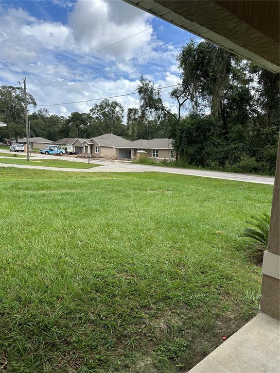 5663 Northwest 57th Street Ocala, FL 34482 - Photo 3 of 19 a view of a big yard with a garden