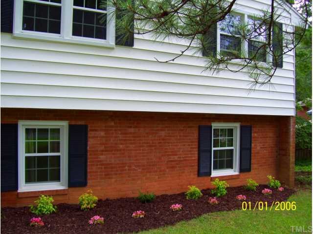 2608 Ramsey Road Raleigh, NC 27604 - Photo 3 of 12 a front view of a house with a garden