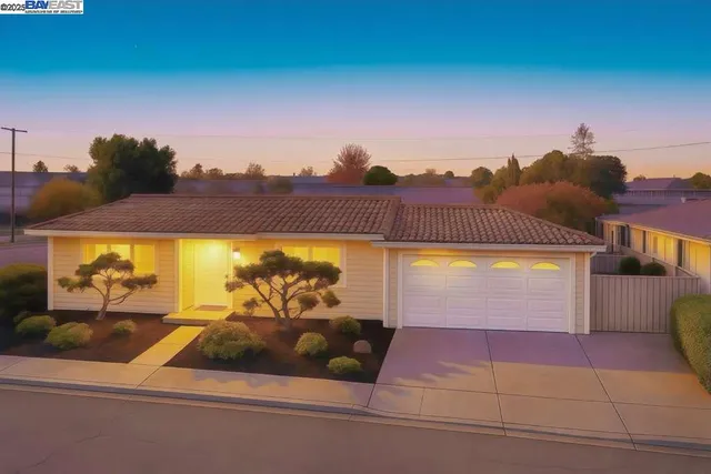a view of a swimming pool with an outdoor seating