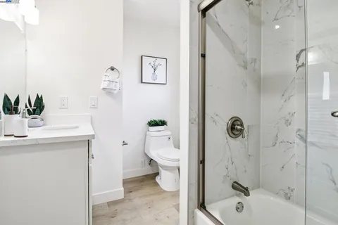 a bedroom with a bed and lamp