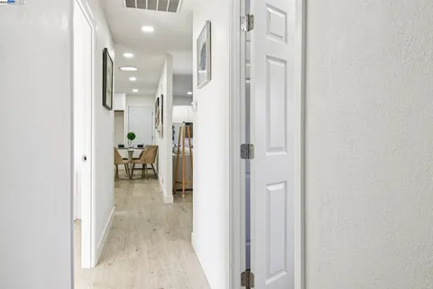 a view of a hallway with a livingroom and a dinning room