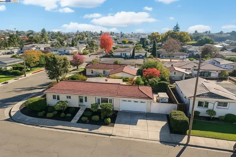 a view of a patio with table and chairs a barbeque