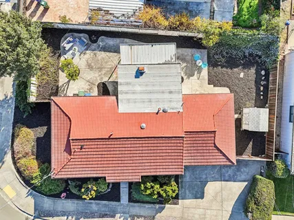 an aerial view of residential houses with outdoor space