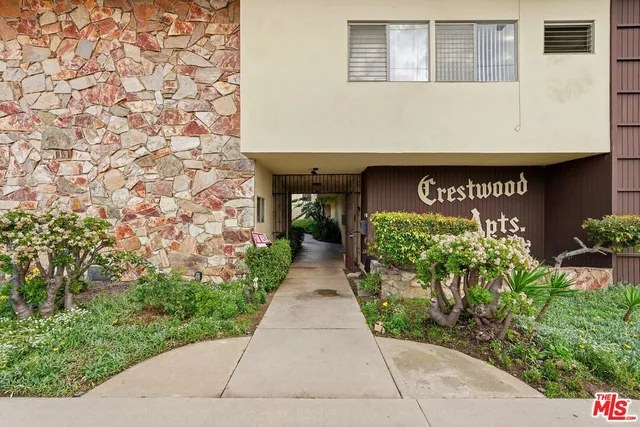 a front view of a building with garden