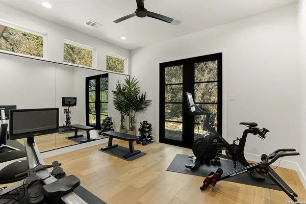 a view of a livingroom with workspace and a window