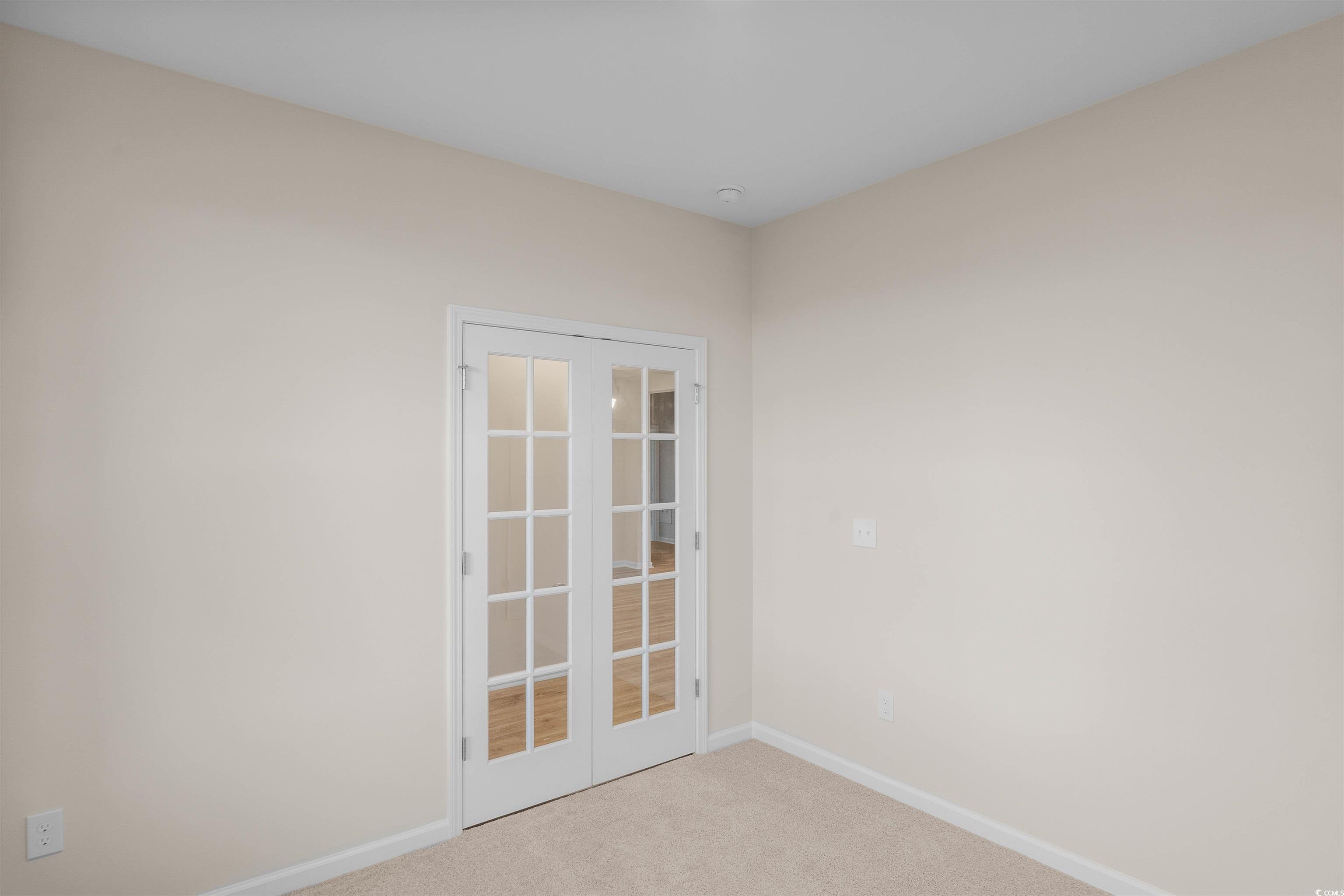500 Sheepbridge Way Longs, SC 29568 - Photo 10 of 26 Unfurnished room featuring carpet and french doors