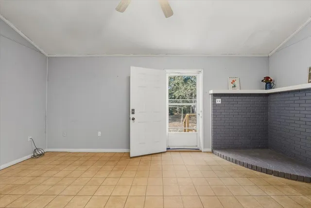a view of room with window and cabinet