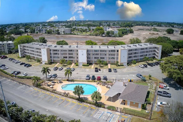 an aerial view of a city with lawn chairs