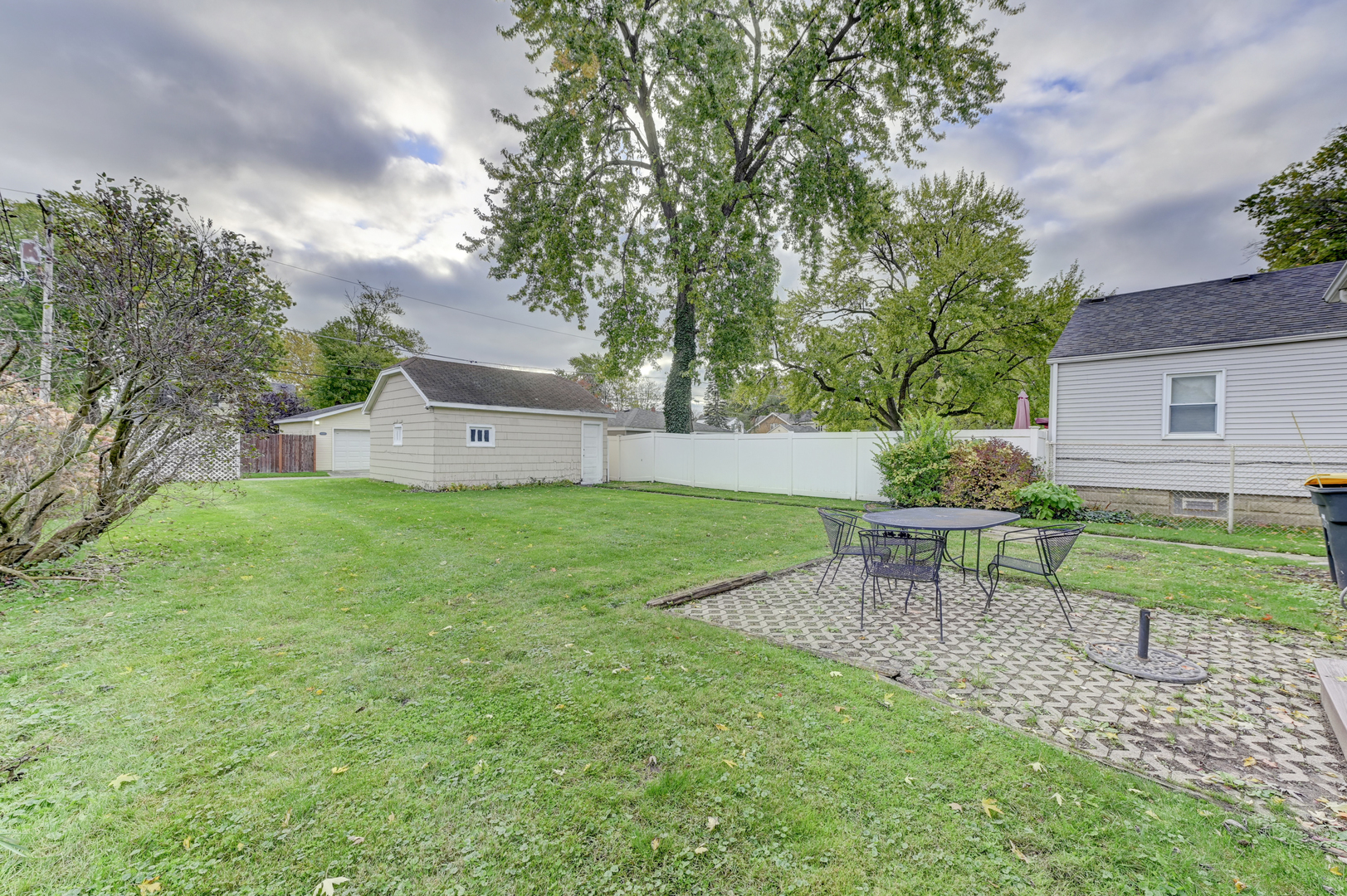18281 Walter Street Lansing, IL 60438 - Photo 14 of 15 a view of a chair and table in the garden