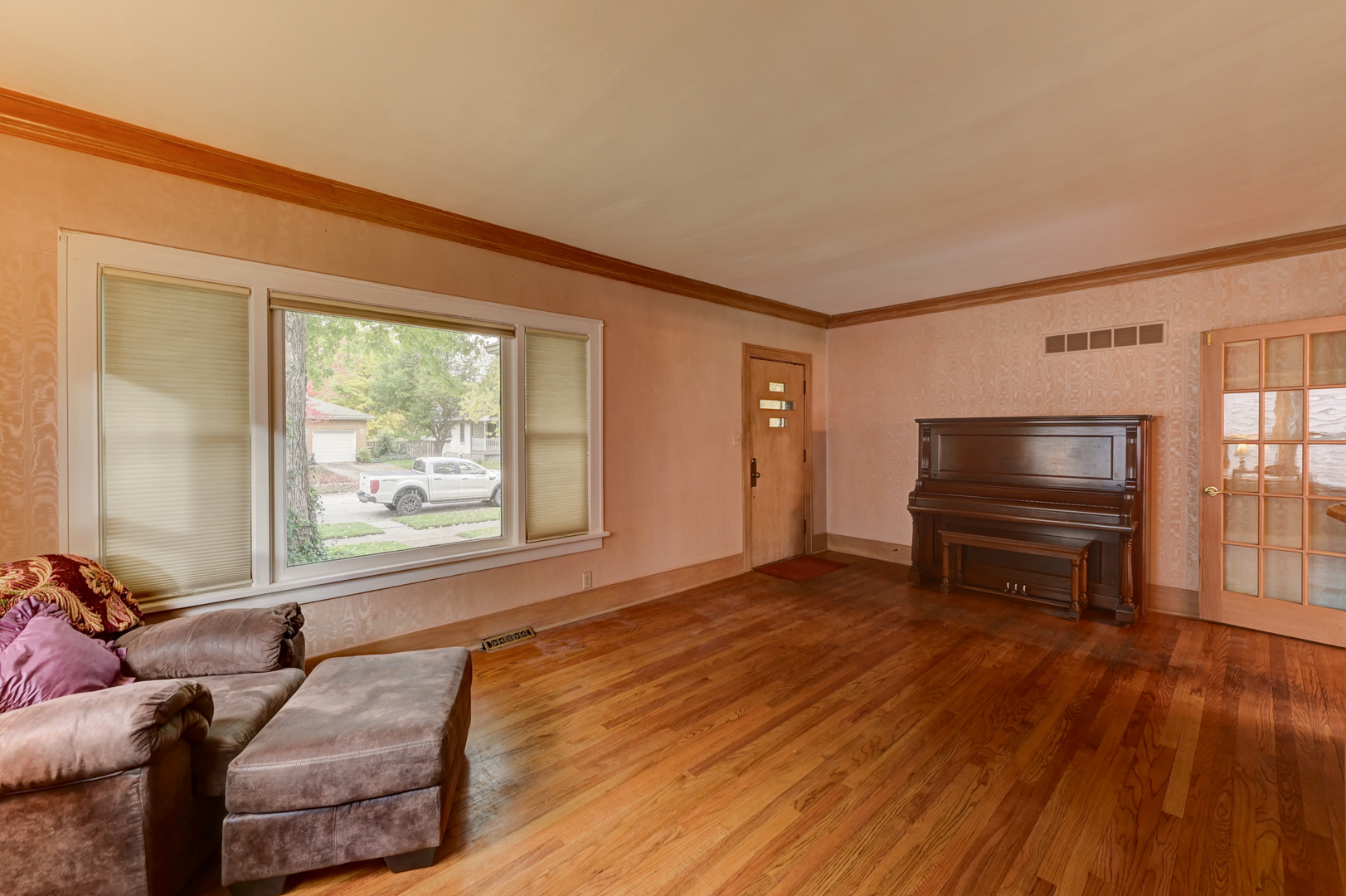 18281 Walter Street Lansing, IL 60438 - Photo 2 of 15 a living room with furniture and a wooden floor