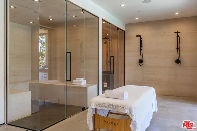 a bathroom with a double vanity sink toilet and shower