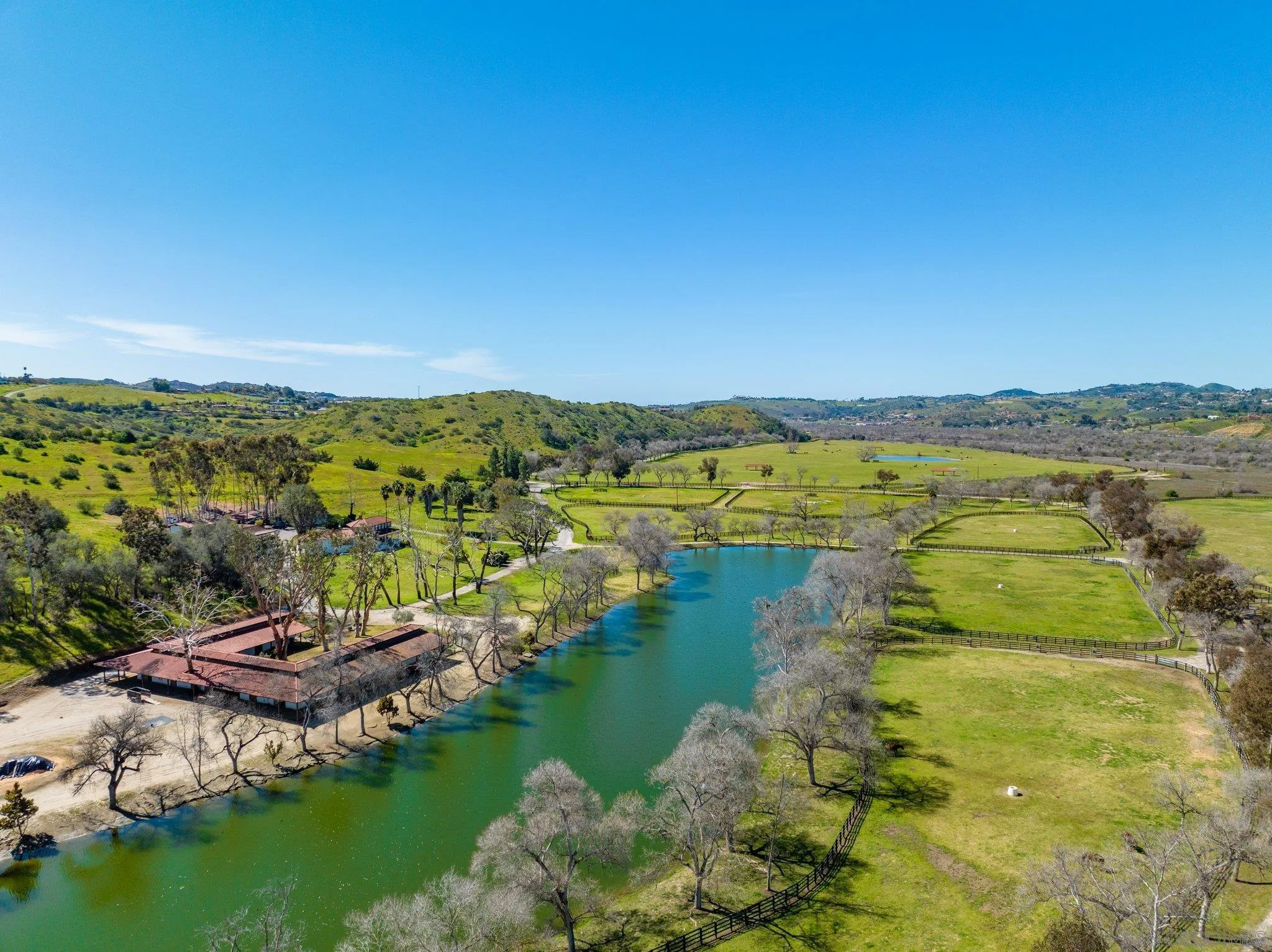 5820 West Lilac Road Bonsall, CA 92003 - Photo 13 of 34 a view of a lake with houses in the back