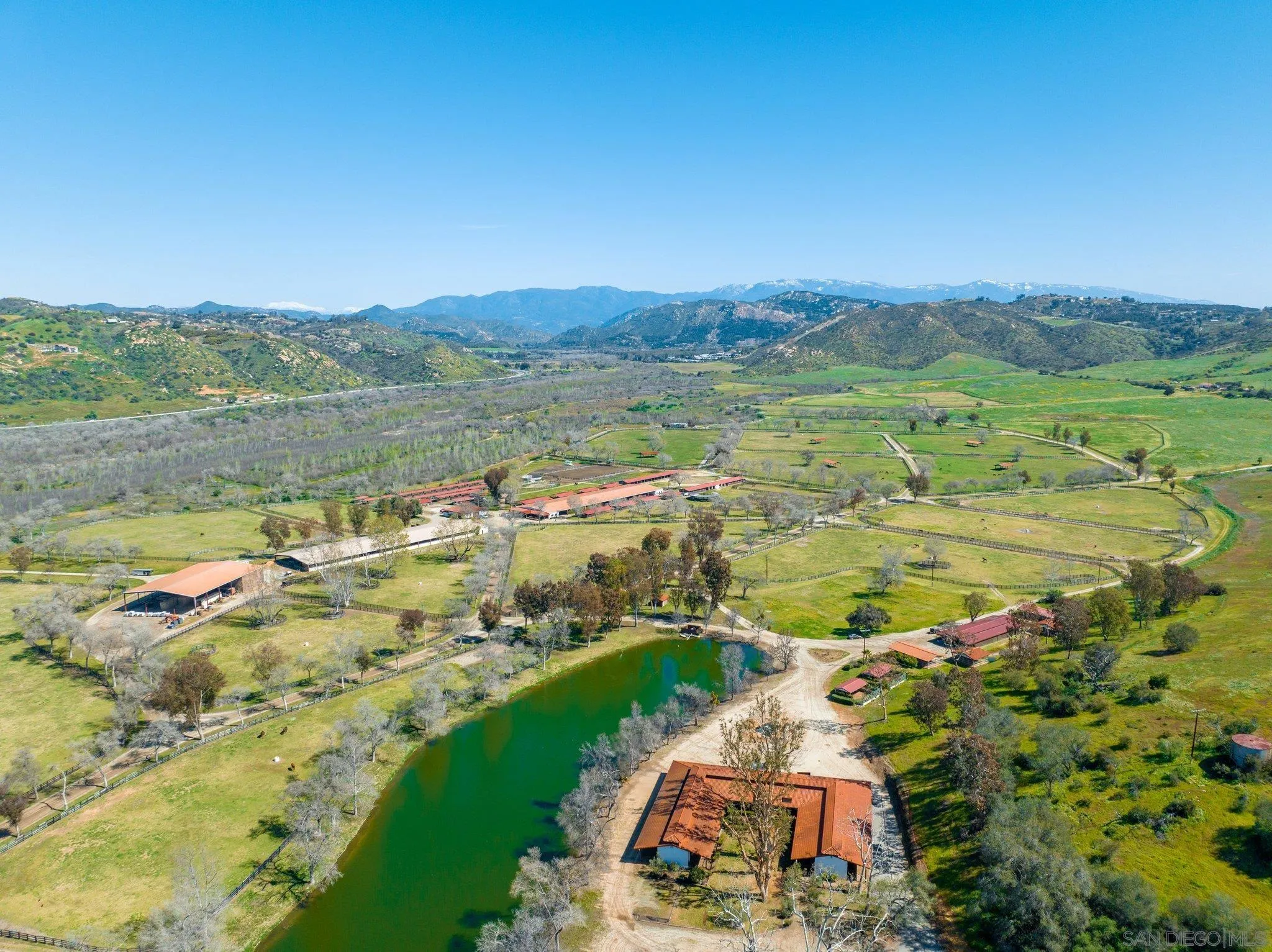 5820 West Lilac Road Bonsall, CA 92003 - Photo 14 of 34 a view of a lake with a yard
