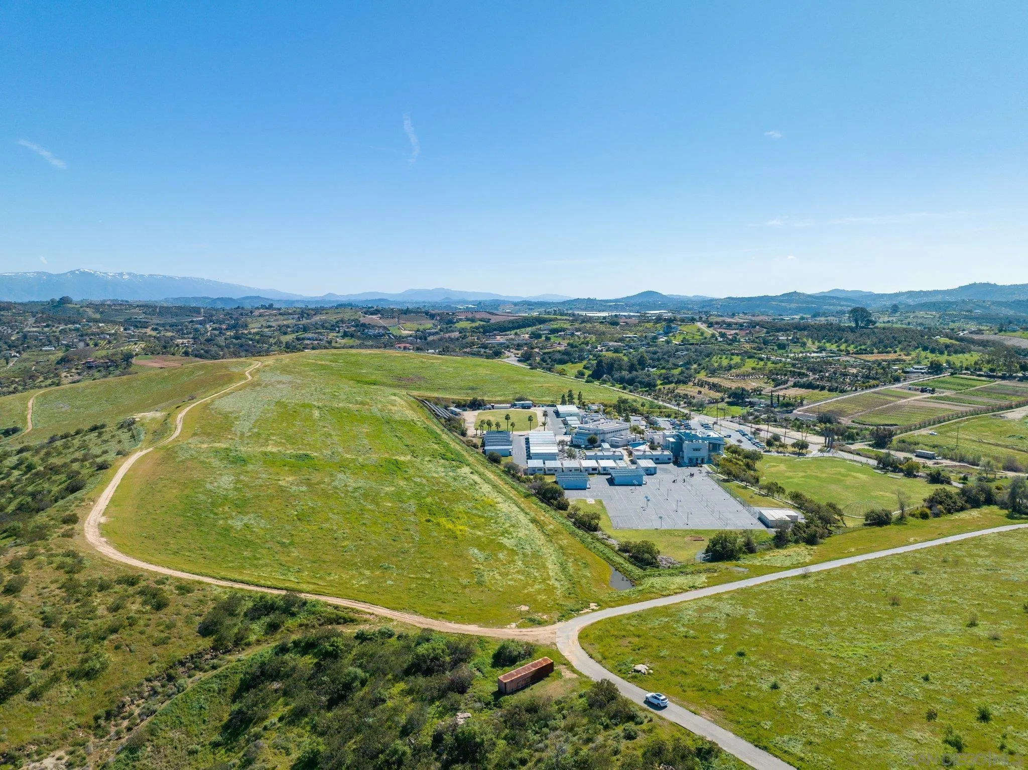 5820 West Lilac Road Bonsall, CA 92003 - Photo 28 of 34 an aerial view of residential houses with outdoor space and swimming pool