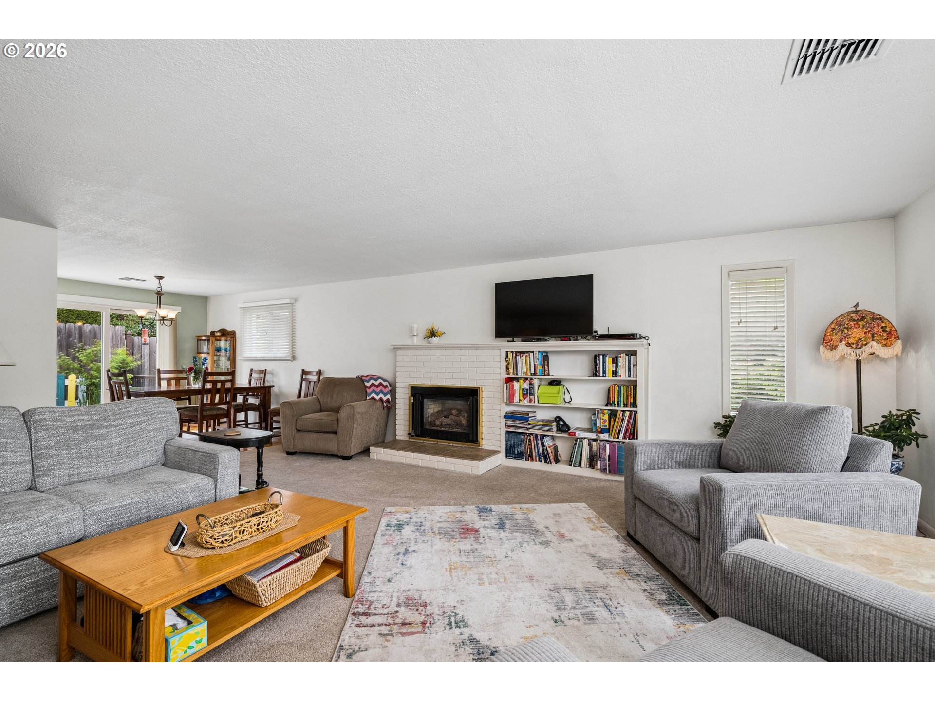 420 Riverview Boulevard Springfield, OR 97477 - Photo 6 of 28 a living room with furniture and a fireplace