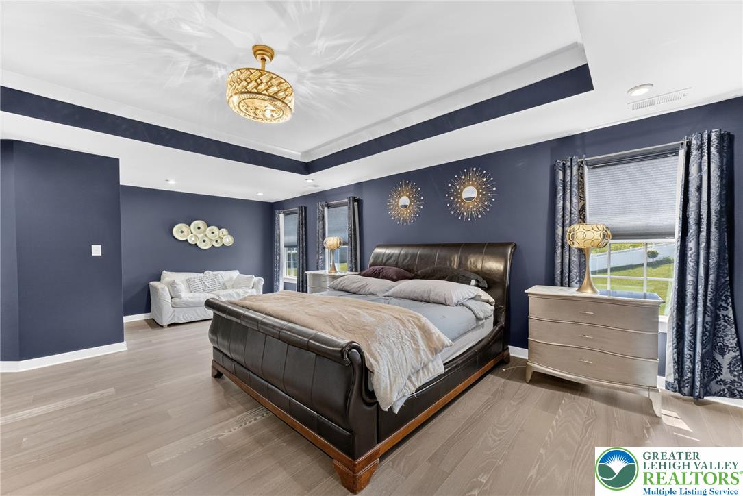 3952 Orth Street Bethlehem, PA 18020 - Photo 22 of 60 Elegant tray ceilings and recessed lighting complement the serene ambiance of this primary sleeping chamber.