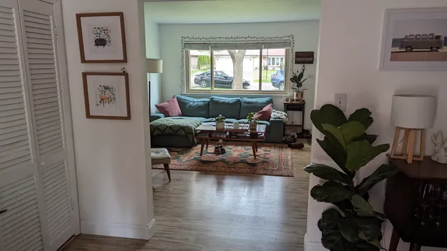a living room with furniture or window and a wooden floor