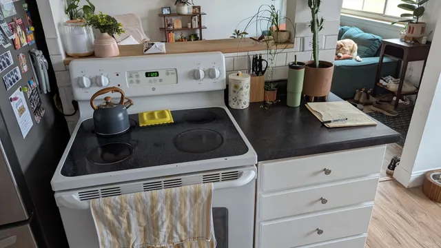 a kitchen with a stove and a refrigerator