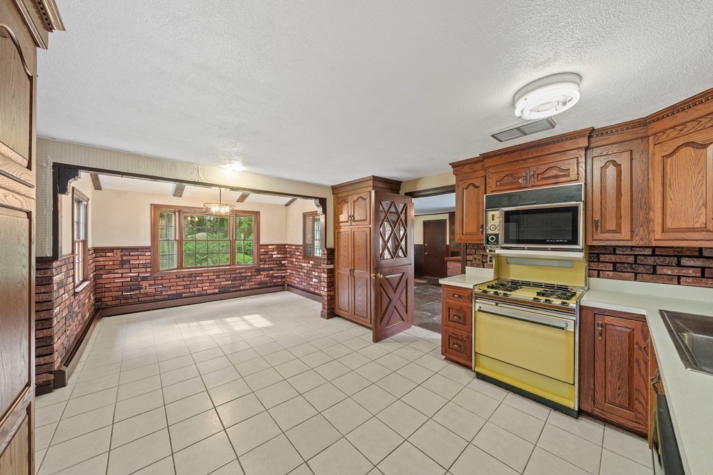 3 Winfield Road Hingham, MA 02043 - Photo 15 of 39 a kitchen with stainless steel appliances a stove a sink and a refrigerator