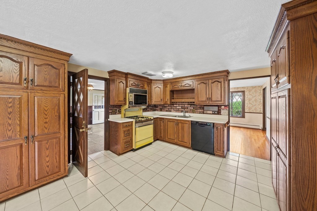 3 Winfield Road Hingham, MA 02043 - Photo 16 of 39 a kitchen with stainless steel appliances granite countertop a refrigerator and a stove top oven