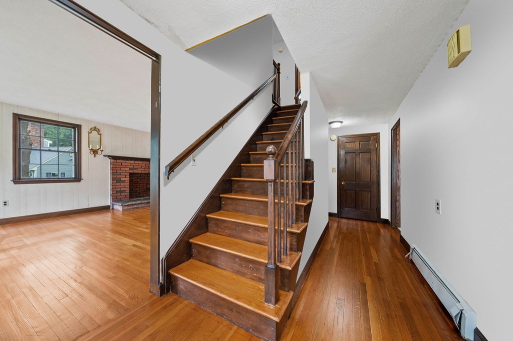 3 Winfield Road Hingham, MA 02043 - Photo 20 of 39 a view of a hallway with wooden floor and staircase